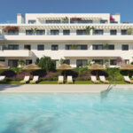 Edificio de Célere Nayra frente a la piscina con tumbonas y sombrillas