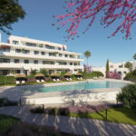 Fachada blanca del residencial Célere Nayra con piscina exterior, jardines y sombrillas en Mijas Costa