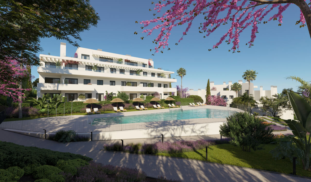 Fachada blanca del residencial Célere Nayra con piscina exterior, jardines y sombrillas en Mijas Costa