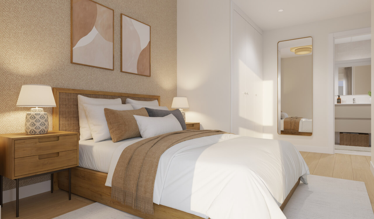 Dormitorio principal de una vivienda de obra nueva Vía Célere Jara, con cama de matrimonio, armarios empotrados, decoración en tonos cálidos y luz natural.