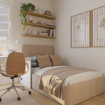 Dormitorio individual de una vivienda de obra nueva Vía Célere Jara, con cama, escritorio de estudio, estanterías de madera, ventana de gran tamaño y decoración moderna en tonos neutros.