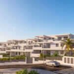 Vista exterior de Vía Célere Victoria I con modernos edificios residenciales, amplias terrazas, zonas ajardinadas y arquitectura contemporánea en un entorno cerca del mar.