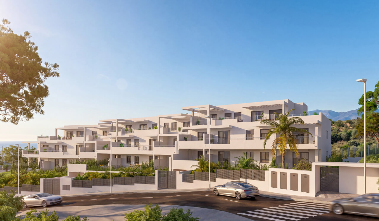 Vista exterior de Vía Célere Victoria I con modernos edificios residenciales, amplias terrazas, zonas ajardinadas y arquitectura contemporánea en un entorno cerca del mar.