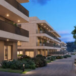 Zona residencial ajardinada de Célere Dalt Mar II al atardecer
