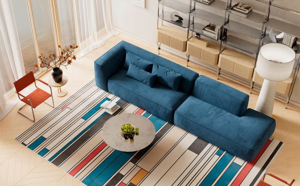 Salón moderno con sofá azul, alfombra de rayas multicolor y muebles que combinan diferentes tonos